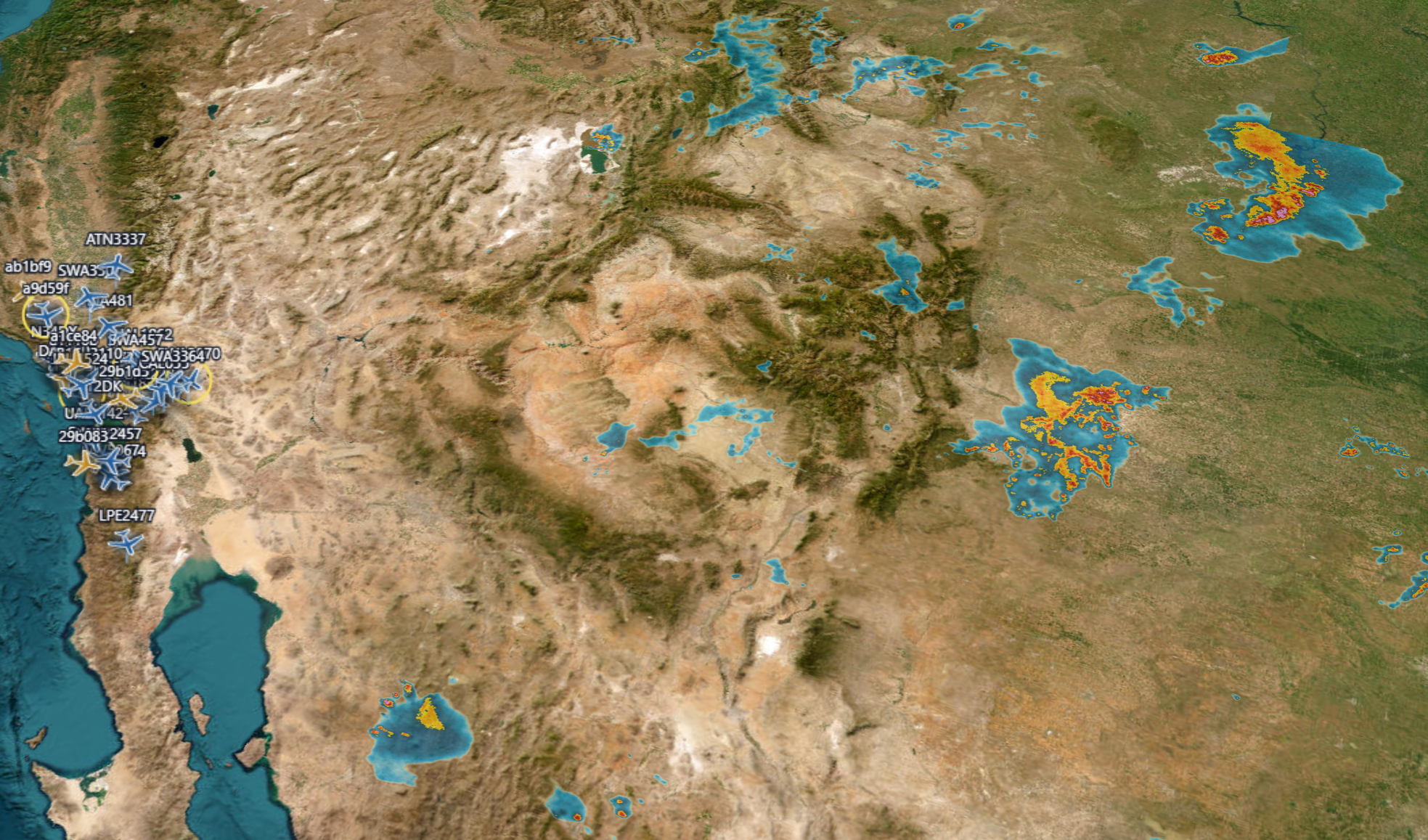 SquitterPro live weather radar overlay on satellite terrain with aircraft